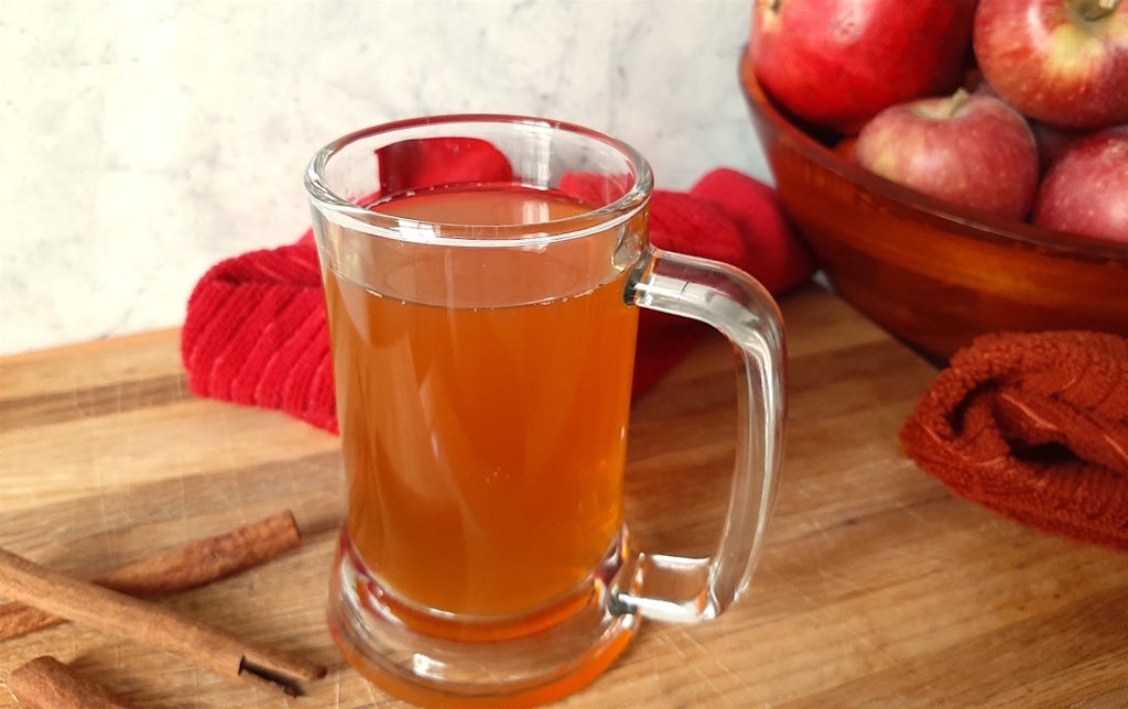 Apple Cider with cinnamon and bourbon. Surrounded by Cinnamon, Apples, Fall Cocktail, Thanksgiving Cocktail, Big Batch Cocktail
