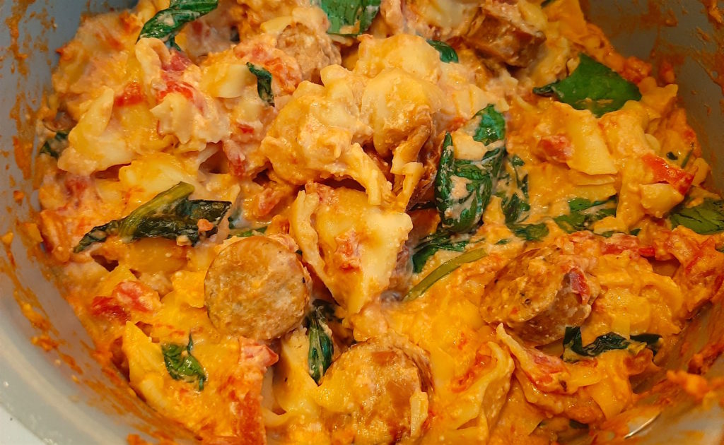 Sausage and Tortellini fall dish with italian chicken sausage, 4 cheese tortellini, cream cheese, canned diced tomatoes, chicken broth, fresh tomatoes, spinach.