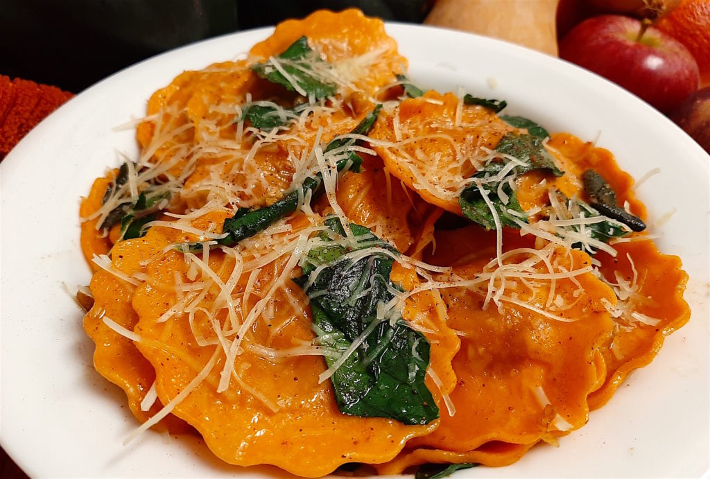 Butternut Squash Ravioli with sage brown butter, spinach, toasted almonds, and parmesan. A lovely fall dinner that makes left overs so you don't have to cook the next night!
