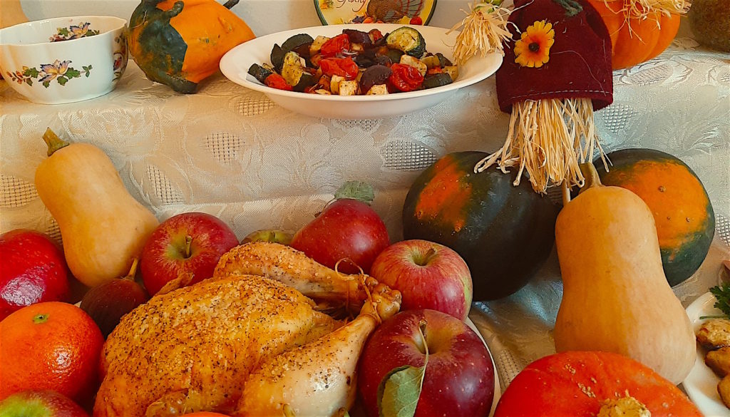 Fall Dinner Spread. Roast Chicken with apples, oranges, and figs. Roast Vegetables, Decorative Squashes, Acorn Squash, Butternut, Kabocha, Pomegranate, Pumpkins, Cranberry Sauce