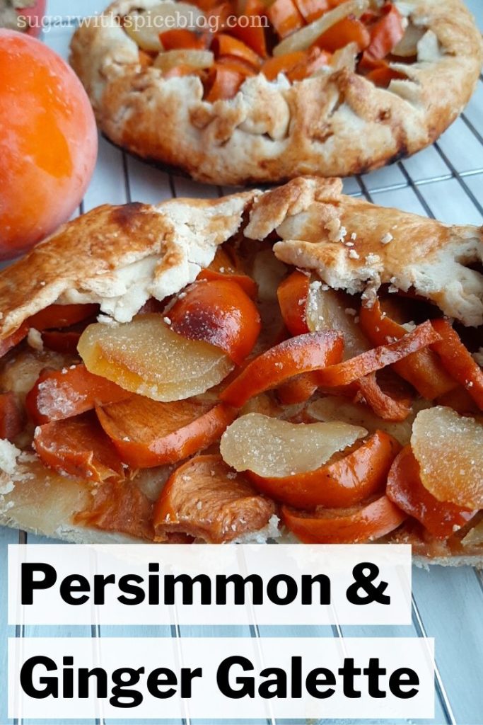 Sliced Persimmon and ginger galette on a cooling rack with a full galette in the background surrounded by hachiya persimmons. Sugar with Spice Blog.