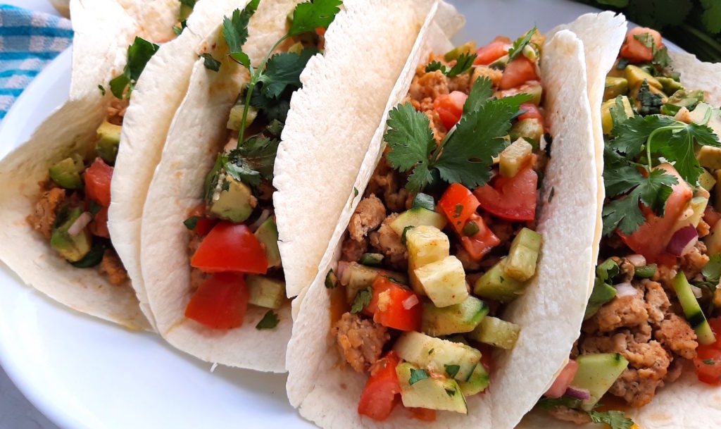 Soft Tacos with ground chicken, refried beans, and Fresh veggie relish