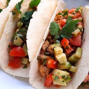 Soft Tacos with ground chicken, refried beans, and Fresh veggie relish
