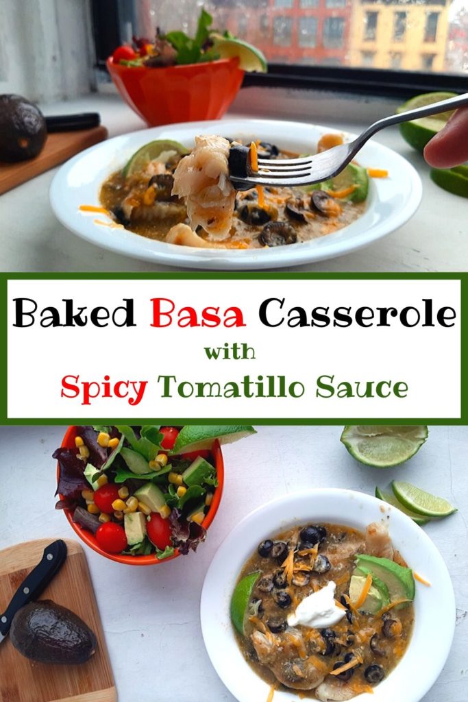 Spicy Basa Casserole with tomatillo sauce, olives, cheddar cheese, avocado slices, sour cream, and lime slices in a white bowl with taco salad in the background. Sugar with Spice Blog