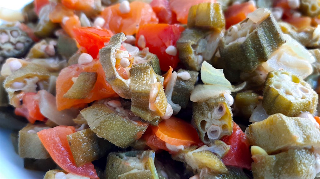 Southern Sautéed okra with onions, garlic, and tomatoes, Close Up Shot in white bowl. Sugar with Spice Blog.