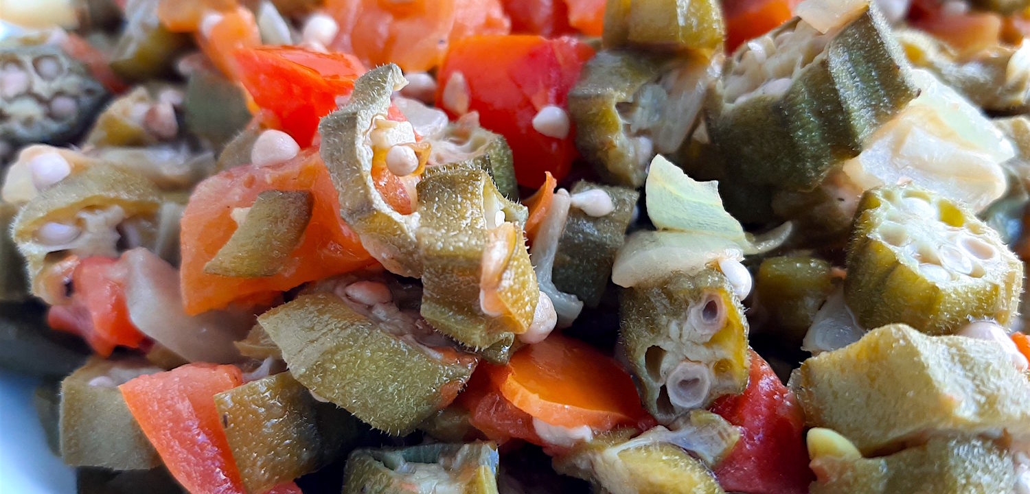 Southern Sautéed okra with onions, garlic, and tomatoes, Close Up Shot in white bowl. Sugar with Spice Blog.