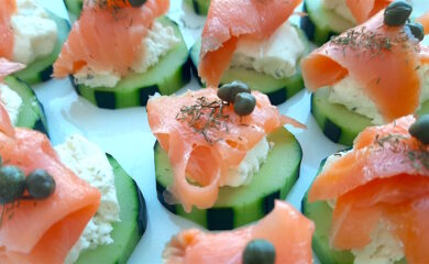 Cucumber Smoked Salmon Bites on a white serving tray with boursin cheese, capers, and smoked salmon. Close up shot. Sugar with Spice Blog.