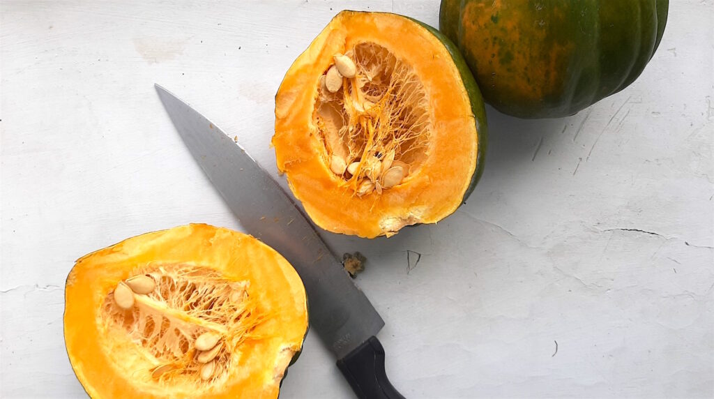 Successfully cut acorn squash, length-wise. Sugar with Spice Blog.